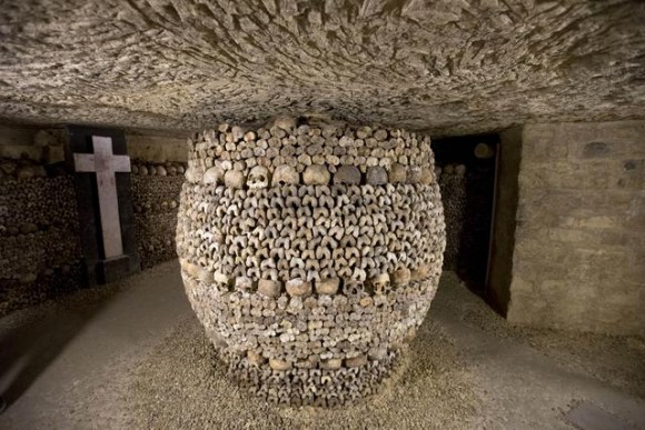 In this photo taken Tuesday, Oct. 14, 2014, skulls and bones are stacked at the Catacombs in Paris, France. The subterranean tunnels, stretching 2 kilometers (1.24 miles), cradle the bones of some 6 million Parisians from centuries past and once gave refuge to smugglers. The site used to close at 5 p.m., but is now staying open until 8 p.m. The change is mainly aimed at allowing more people to visit and reducing long lines, since it can only hold a limited number of people at a time and visits cant be reserved in advance. (AP Photo/Francois Mori)