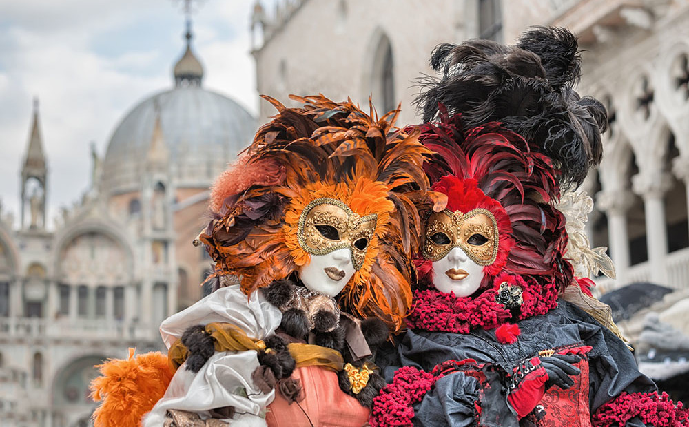 VENICE, ITALY - FEBRUARY 27, 2014: Unidentified person with Venetian Carnival mask in Venice, Italy on February 2014. In 2014 was the Venetian Carnival held between 15 February and 4 march