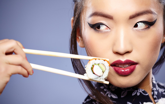 asian-woman-eating-sushi